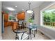 Cozy kitchen nook with large windows and easy access to a wooden deck at 7918 Dairy Ridge Rd, Mebane, NC 27302