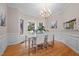 Charming dining room features natural light, chandelier, and detailed molding at 7918 Dairy Ridge Rd, Mebane, NC 27302