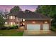 Stunning brick home showcasing a two-car garage and well-manicured landscaping at 7918 Dairy Ridge Rd, Mebane, NC 27302