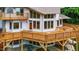 Exterior of house showing multilevel deck, multi-pane windows and wooded lot at 7918 Dairy Ridge Rd, Mebane, NC 27302