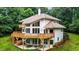 Well maintained home with large deck, surrounded by lush greenery at 7918 Dairy Ridge Rd, Mebane, NC 27302
