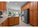 Spacious kitchen with stainless appliances, wood cabinets, and convenient access to the back deck at 7918 Dairy Ridge Rd, Mebane, NC 27302