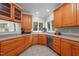 Classic kitchen offers wood cabinetry and expansive countertops overlooking a green backyard at 7918 Dairy Ridge Rd, Mebane, NC 27302