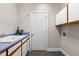 Functional laundry room featuring a sink, cabinets, and ample space for storage at 7918 Dairy Ridge Rd, Mebane, NC 27302
