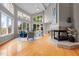 Inviting living room with high ceilings, fireplace, and scenic views from expansive windows at 7918 Dairy Ridge Rd, Mebane, NC 27302