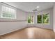 Finished room with hardwood floors, natural lighting and exterior view at 7918 Dairy Ridge Rd, Mebane, NC 27302