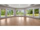 Spacious room with hardwood floors, recessed lighting and large windows overlooking the backyard at 7918 Dairy Ridge Rd, Mebane, NC 27302