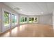 Large room with hardwood floors, recessed lighting, windows and patio access at 7918 Dairy Ridge Rd, Mebane, NC 27302