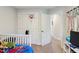 Bright bedroom features carpet flooring and a white closet with a mini basketball hoop at 805 Winter Meadow Dr, Wake Forest, NC 27587