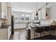 Modern kitchen features white cabinets, granite countertops, and stainless steel appliances at 805 Winter Meadow Dr, Wake Forest, NC 27587