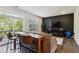 Open concept living room area with hardwood floors, modern decor, and access to the balcony at 805 Winter Meadow Dr, Wake Forest, NC 27587