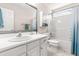 Bathroom with white vanity, white cabinets, white toilet, white bath tub, and shower at 8116 Owenston Ct, Raleigh, NC 27612