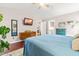 Cozy bedroom with ensuite bath access, natural light, and hardwood floors at 8116 Owenston Ct, Raleigh, NC 27612