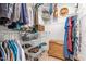 Walk-in closet featuring wire shelving, hanging rods, and a large woven basket for optimal storage at 8116 Owenston Ct, Raleigh, NC 27612