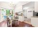 Open dining area with bay window flows into well-lit kitchen at 8116 Owenston Ct, Raleigh, NC 27612