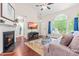 Open concept living room showcasing a fireplace and seamless access to kitchen at 8116 Owenston Ct, Raleigh, NC 27612