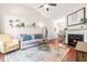 Bright living room features a fireplace, hardwood floors, and ample natural light at 8116 Owenston Ct, Raleigh, NC 27612