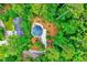 Aerial shot showcases the property's unique design and natural wooded setting at 819 & 818 Hilltop Cir, Sanford, NC 27332
