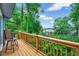Relaxing outdoor deck with views of lush greenery, showcasing a table with chairs for outdoor dining at 819 & 818 Hilltop Cir, Sanford, NC 27332