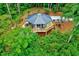 Secluded home featuring a wraparound deck perfect for relaxing in nature at 819 & 818 Hilltop Cir, Sanford, NC 27332