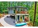 Unique house design with natural surroundings with gray and white siding and an outdoor patio at 819 & 818 Hilltop Cir, Sanford, NC 27332