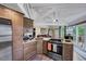 Charming kitchen featuring stainless appliances, granite counters, and access to the porch at 819 & 818 Hilltop Cir, Sanford, NC 27332