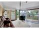 Comfortable living room showcasing plush seating, an entertainment area, and access to an outdoor deck with scenic views at 819 & 818 Hilltop Cir, Sanford, NC 27332