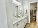 Bright bathroom features double sinks, marble countertops, and decorative towels and accessories at 923 Springfork Dr, Cary, NC 27513