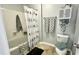 Full bathroom featuring a tub and shower combination and decorative towels and accessories on shelves at 923 Springfork Dr, Cary, NC 27513