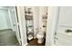 This half bath features a charming design, complete with decorative shelving and fresh paint at 923 Springfork Dr, Cary, NC 27513