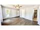 Spacious bedroom features wood floors, ceiling fan, and access to a balcony through a glass door at 923 Springfork Dr, Cary, NC 27513