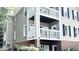 Multi-level building with balconies, brick accents, and black shutters at 923 Springfork Dr, Cary, NC 27513