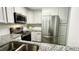 Modern kitchen featuring stainless steel appliances, granite countertops, and white cabinets at 923 Springfork Dr, Cary, NC 27513
