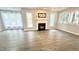 Bright living room features lots of natural light, a fireplace, and hardwood floors at 923 Springfork Dr, Cary, NC 27513