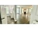 Spacious and bright living room with hardwood floors and a view of the fireplace at 923 Springfork Dr, Cary, NC 27513
