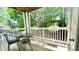 Enjoy the outdoors with an elegant iron table and chairs, and plants on this shaded patio at 923 Springfork Dr, Cary, NC 27513