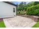 Spacious backyard patio, complimented by manicured garden and exterior hardscaping at 9713 San Remo Pl, Wake Forest, NC 27587