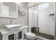 Sleek bathroom with glass shower, a modern sink and stylish fixtures at 9713 San Remo Pl, Wake Forest, NC 27587