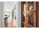Open hallway view showcasing a dining area and living room with hardwood floors and modern finishes at 9713 San Remo Pl, Wake Forest, NC 27587