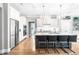 Modern kitchen with white cabinetry, quartz countertops, stainless steel appliances, and large island with seating at 9713 San Remo Pl, Wake Forest, NC 27587