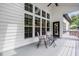 Covered porch featuring comfortable seating, offering a relaxing space, ceiling fan, and natural light at 9713 San Remo Pl, Wake Forest, NC 27587
