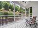 Screened porch offering relaxing outdoor space with garden views and comfortable seating for enjoyment at 9713 San Remo Pl, Wake Forest, NC 27587