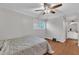 Bedroom featuring a ceiling fan, window and plenty of space to relax and unwind at 1008 Sandlin Pl # J, Raleigh, NC 27606