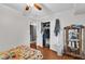 Bedroom featuring a ceiling fan, open closet and plenty of space to relax and unwind at 1008 Sandlin Pl # J, Raleigh, NC 27606