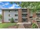 Brick apartment building featuring upper level balconies and grey siding at 1008 Sandlin Pl # J, Raleigh, NC 27606