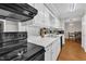 Efficient kitchen layout with black oven range and ample counter space at 1008 Sandlin Pl # J, Raleigh, NC 27606