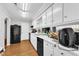 Functional kitchen with black appliances and white cabinetry at 1008 Sandlin Pl # J, Raleigh, NC 27606