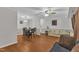 Open-concept living room and dining area with wood floors and neutral decor at 1008 Sandlin Pl # J, Raleigh, NC 27606
