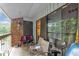 Outdoor patio area featuring a brick wall and views of the nearby trees at 1008 Sandlin Pl # J, Raleigh, NC 27606