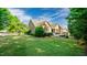 Expansive backyard with lush green lawn and mature trees surrounding the property at 101 Synandra Ln, Holly Springs, NC 27540